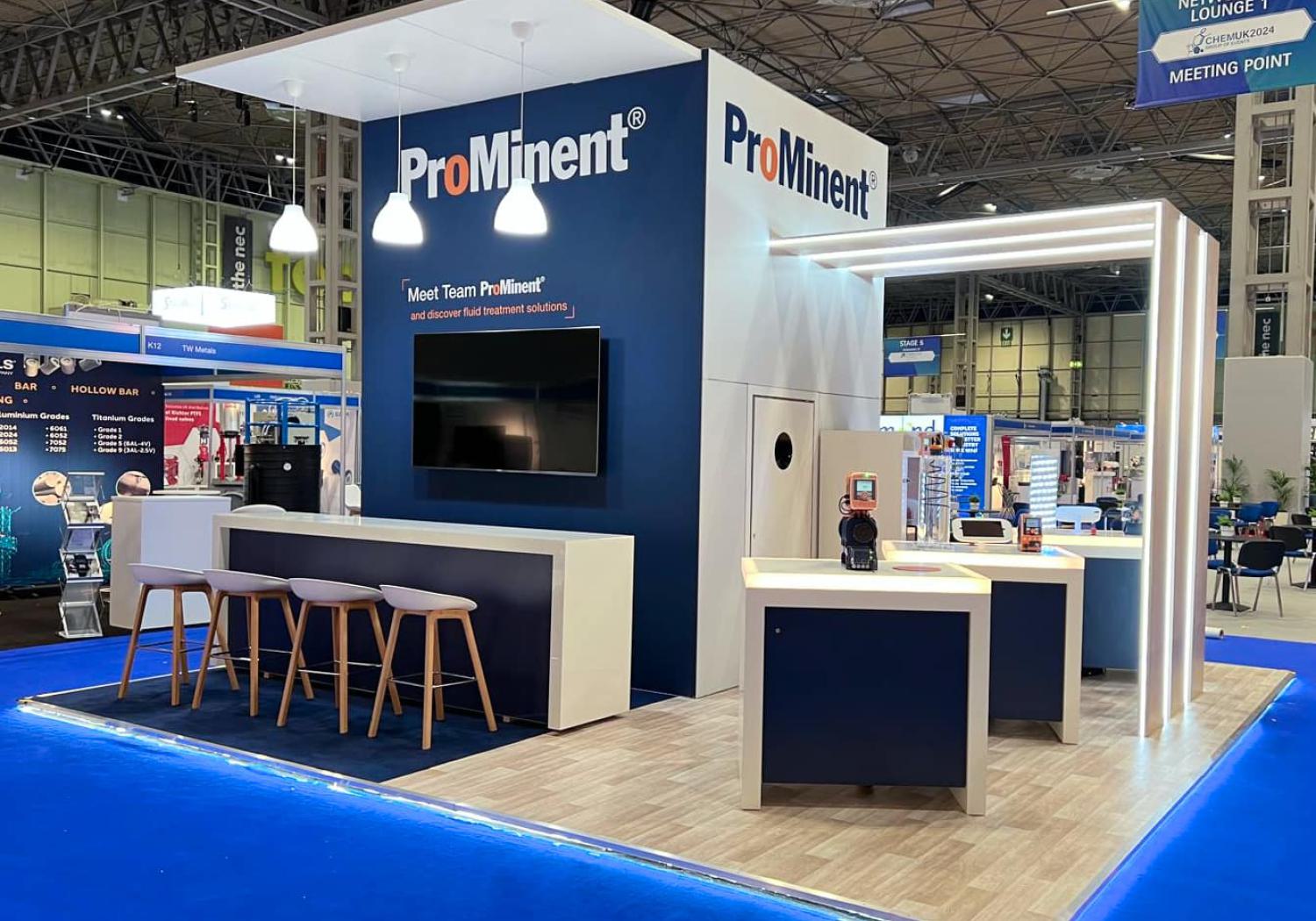 ProMinent stand at Chem UK, 4 walled island with pergola coming off, pennant-lit roof